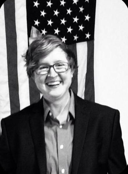 Candace Dillard smiling in a dark blazer